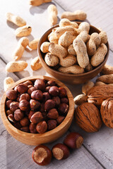 Composition with two bowls of hazelnuts and peanuts