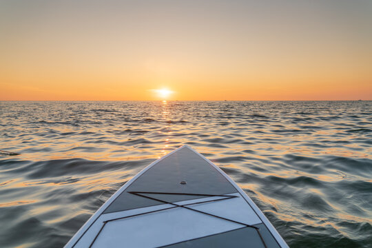 View from paddle board on Lake Michigan at sunset