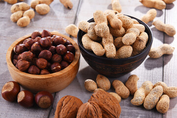 Composition with two bowls of hazelnuts and peanuts