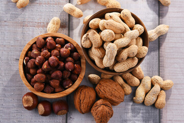 Composition with two bowls of hazelnuts and peanuts