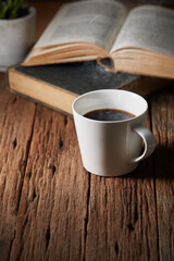 Cup of coffee with book