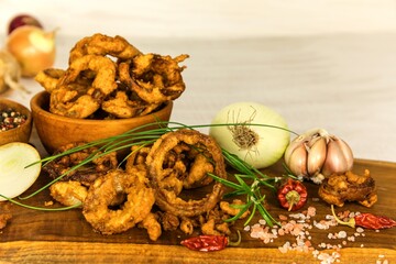 Large group of freshly fried onion rings. Homemade Crunchy Fried Onion Rings. Unhealthy food.