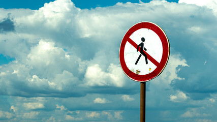 road sign passage is forbidden against the blue sky