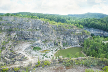 Fototapeta na wymiar Photography of an open pit development, top view. Quarry mining of minerals and minerals, mines and industry.