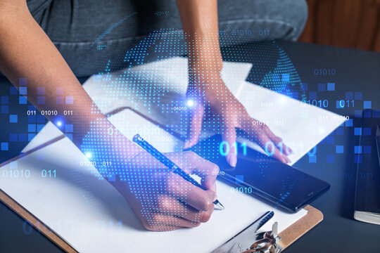 Businesswoman taking notes using smart-phone. World map hologram double exposure. - Powered by Adobe