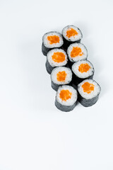 Rolls with red fish, fresh rice with salmon wrapped in nori.