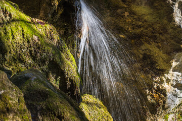 delicate waterfall in the mountains detail