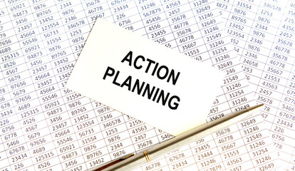 Obraz premium On the card is the inscription planning, against the background of accounting and pens.