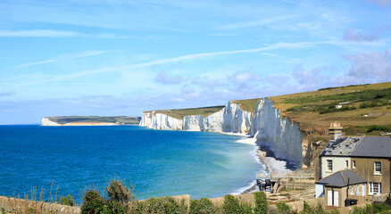 Seven Sisters Cliffs on a bright summer day with beautiful cloudscape sky. Birling Gap, Near...