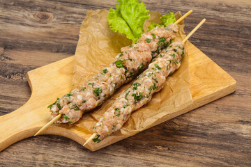 Raw minced pork skewer kebab for grill