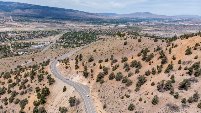 Drone photo over traffic going up mountain roads on Geiger grade near Virginia City