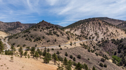 Drone photo over traffic going up mountain roads on Geiger grade near Virginia City