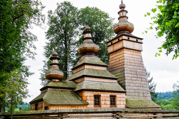 KWIATON, POLAND - AUGUST 12, 2017: Beautiful ancient wooden greek catholic church listed on UNESCO in Beskid Niski mountain range, Poland - obrazy, fototapety, plakaty