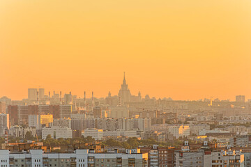 Fototapeta na wymiar Cityscape of Moscow city in Russia during golden sunset. Small haze in the air. Golden hour theme.