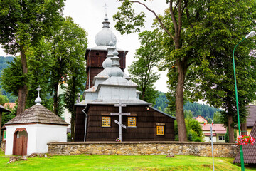 Beautiful ancient wooden greek catholic church listed on UNESCO in Beskid Niski mountain range, Poland - obrazy, fototapety, plakaty
