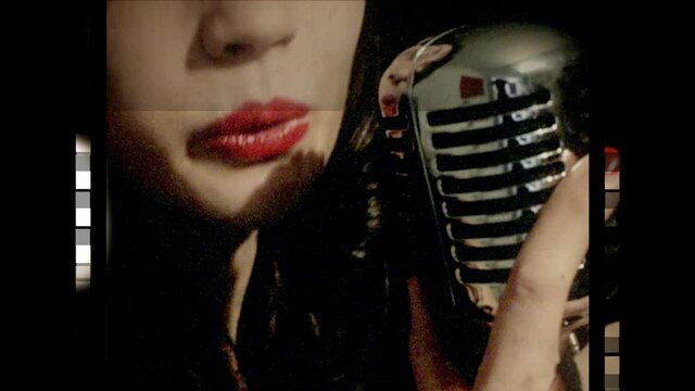 A fake 8mm film with a fast-moving perforated strip, showing a classy young woman (extreme closeup) singing on stage with a retro vintage microphone.
