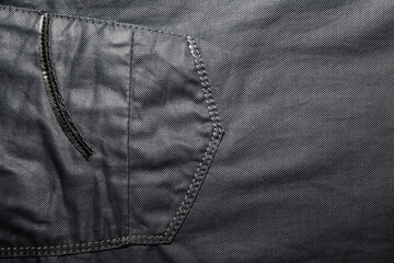 Black background of creased, UN-ironed trousers