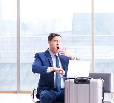 Businessman waiting at the airport for his plane in business cla