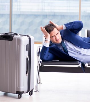 Businessman waiting at the airport for his plane in business cla