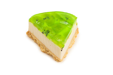 Piece of kiwi cheesecake isolated on white.