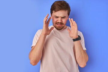 Fototapeta premium irritated guy denies everything, caucasian bearded man dissatisfied with news, feel negative emotions