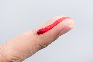 Bleeding blood from the cut finger wound. Injured finger with bleeding open cut wound. Closeup of...