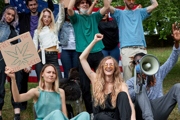 protest concerning marijuana, cannabis legalization in the streets. american activists with posters...