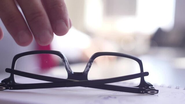 businessman picking up glasses slow motion