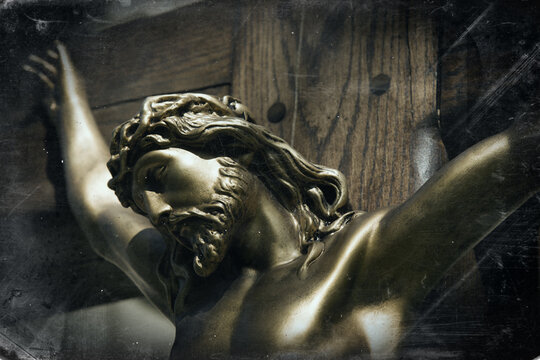 An ancient statue of the crucifixion of Jesus Christ. Close up.