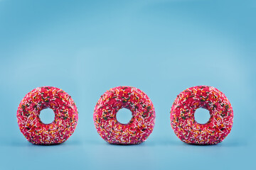Donuts standing on a blue background