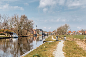 Fototapeta na wymiar Canal and townscape in Hindeloopen, Friesland, Netherlands, Europe