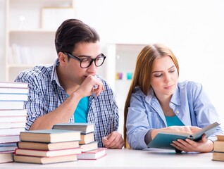 Pair of students studying for university exams