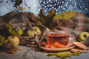 cup of tea and autumn leaves