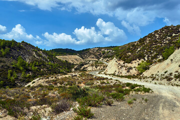 Fototapeta na wymiar Gravel road in the rocky mountains of Rhodes island
