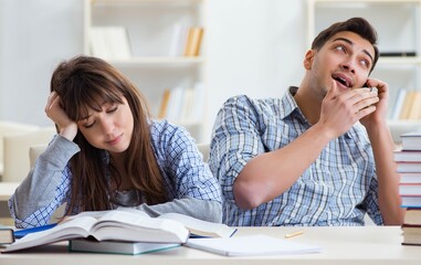 Students sitting and studying in classroom college