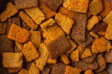 Close-up of crackers with spices, snack for beer and kvass. Food background concept 