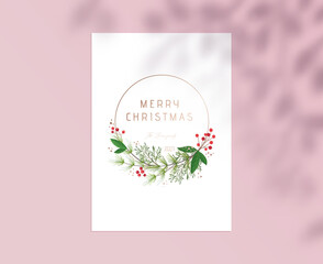 Merry Christmas Card with Gold Typography, Botanical Floral Design of Holly Berries and Green Plant on White Paper Sheet