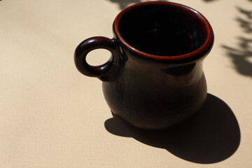 Small brown cup on a brown background