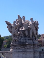 Fototapeta na wymiar Sculpture on the bridge over the Tiber river in Rome in Italy.