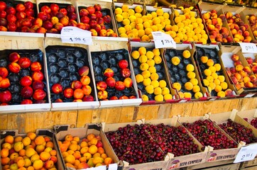 Fresh organic fruits and vegetables on display in a food stall in Barcelona, Spain