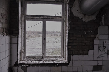 Abandoned house with old and broken window