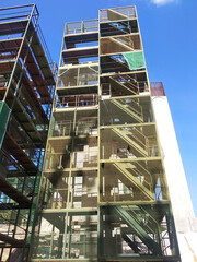 SEREMBAN, MALAYSIA -MAY 24, 2020: Temporary access and metal staircase made from staging, scaffolding and metal platform under construction at the construction site. 