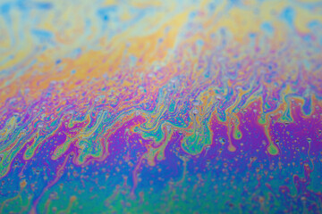 Abstract background texture of iridescent paints. Soap bubble