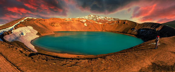 Majestic Viti crater in Krafla volcanic area, Iceland. Tipical Icelandic nature landscape during sunset. Great view on azure lake in Viti crater. Iceland the country of many volkans, and Glaciers.