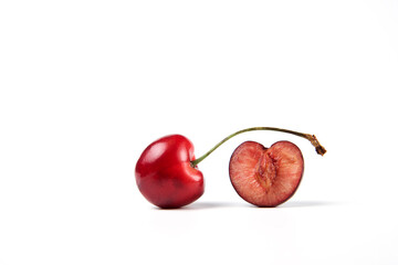 A red juicy fresh cherry on white background