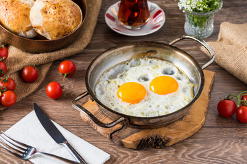 Traditional Turkish Breakfast - Fried Egg, Bread, tomato and Tea