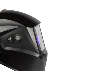 Black mask to perform welding work on a white background, view from the side.