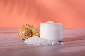 Sea Salt Skin Care Cosmetics. Dead sea natural cream on a marble background.