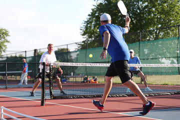 A backhand is hit for a winner during a mixed doubles pickleball match
