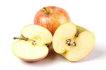 Whole and sliced red apples on white